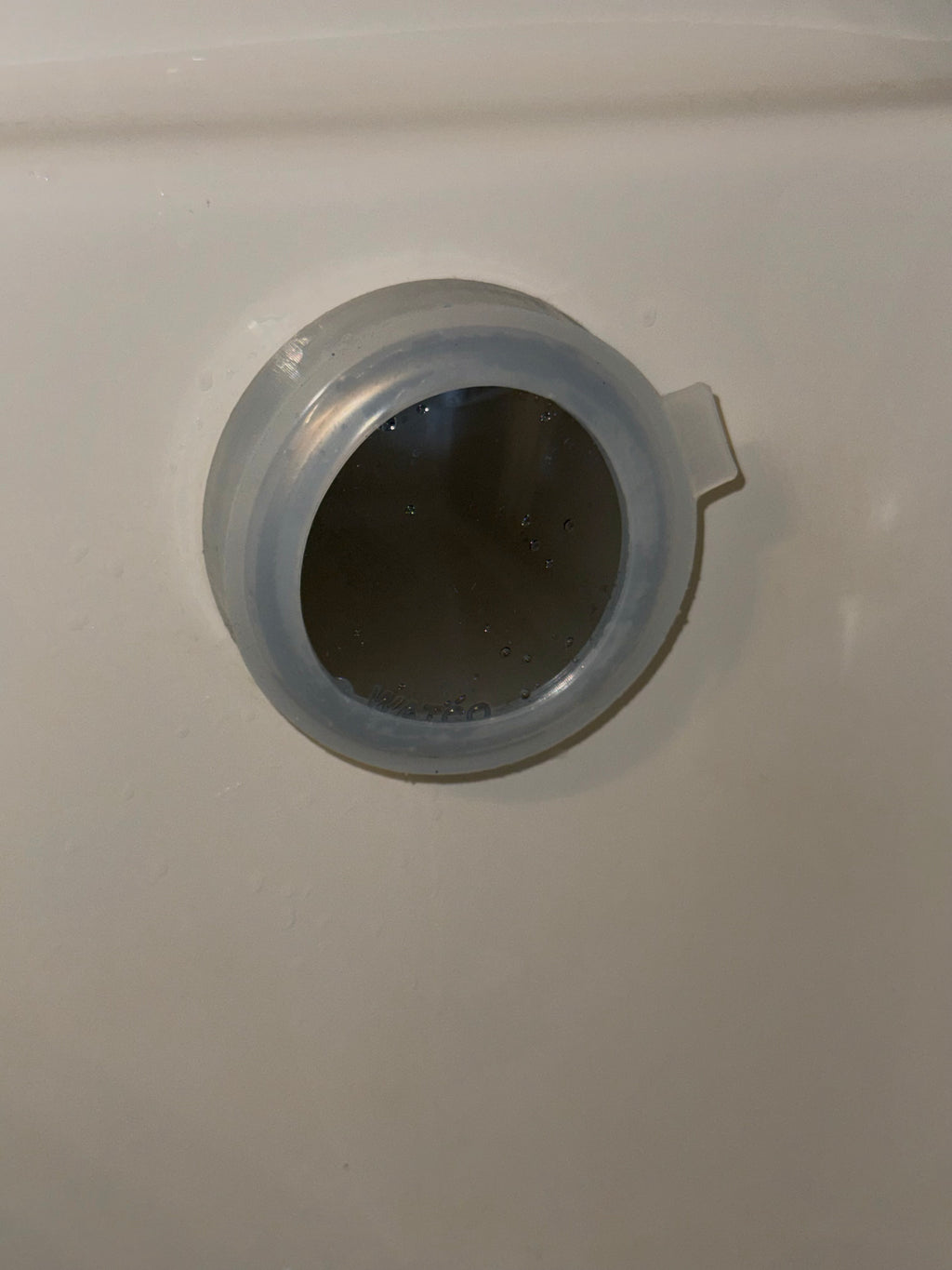 Tub Tie™ Overflow Drain Cover